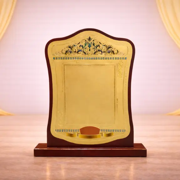 Ornate award plaque on spotlighted base